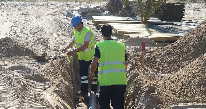 Vacuum mains are installed in shallow ground and do not require manholes at turns.
