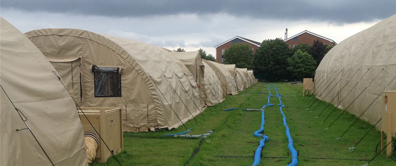 Deployable vacuum systems used in temporary camp facility. vacuum mains laid above ground